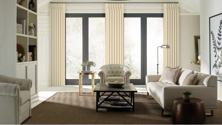 roman shades being used as living room window coverings
