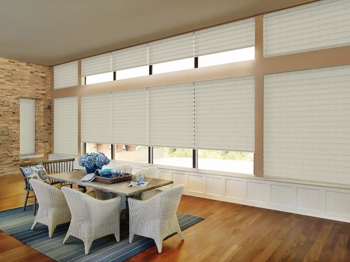 floor to ceiling roller shades and sliding door window coverings in living room 