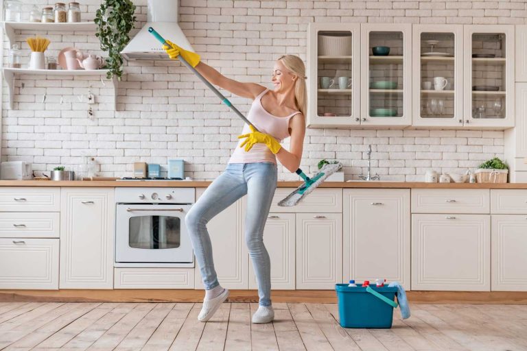 woman using safe cleaners for hardwood floors